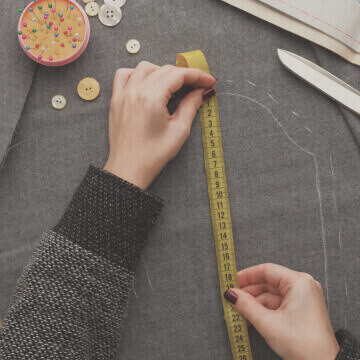 Measuring fabric with measuring tape for a flattering fit